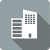 Business icon depicted by a tall white building on a grey square