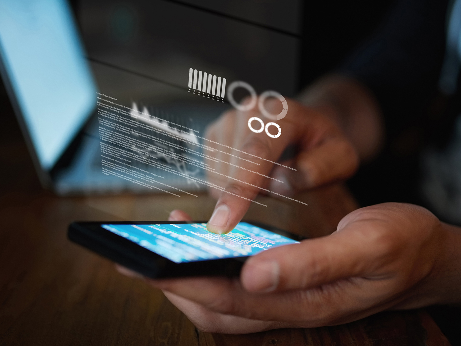 man tapping on mobile device