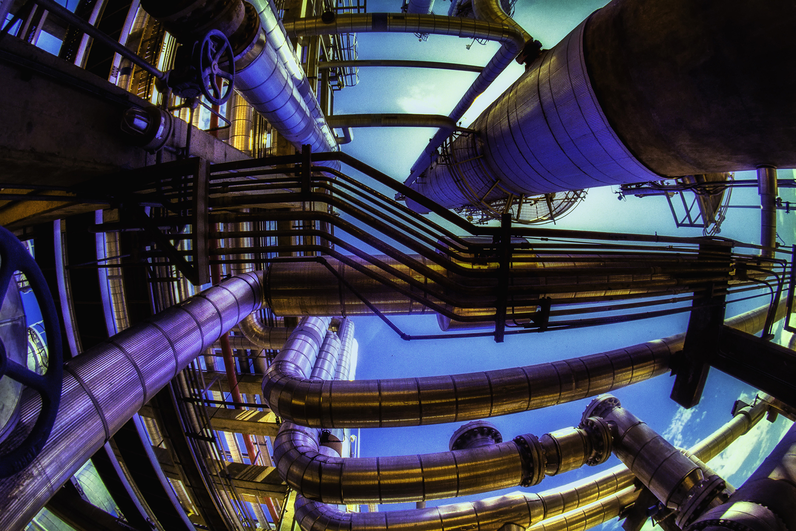 Gas pipes phtographed from underneath and cross processed
