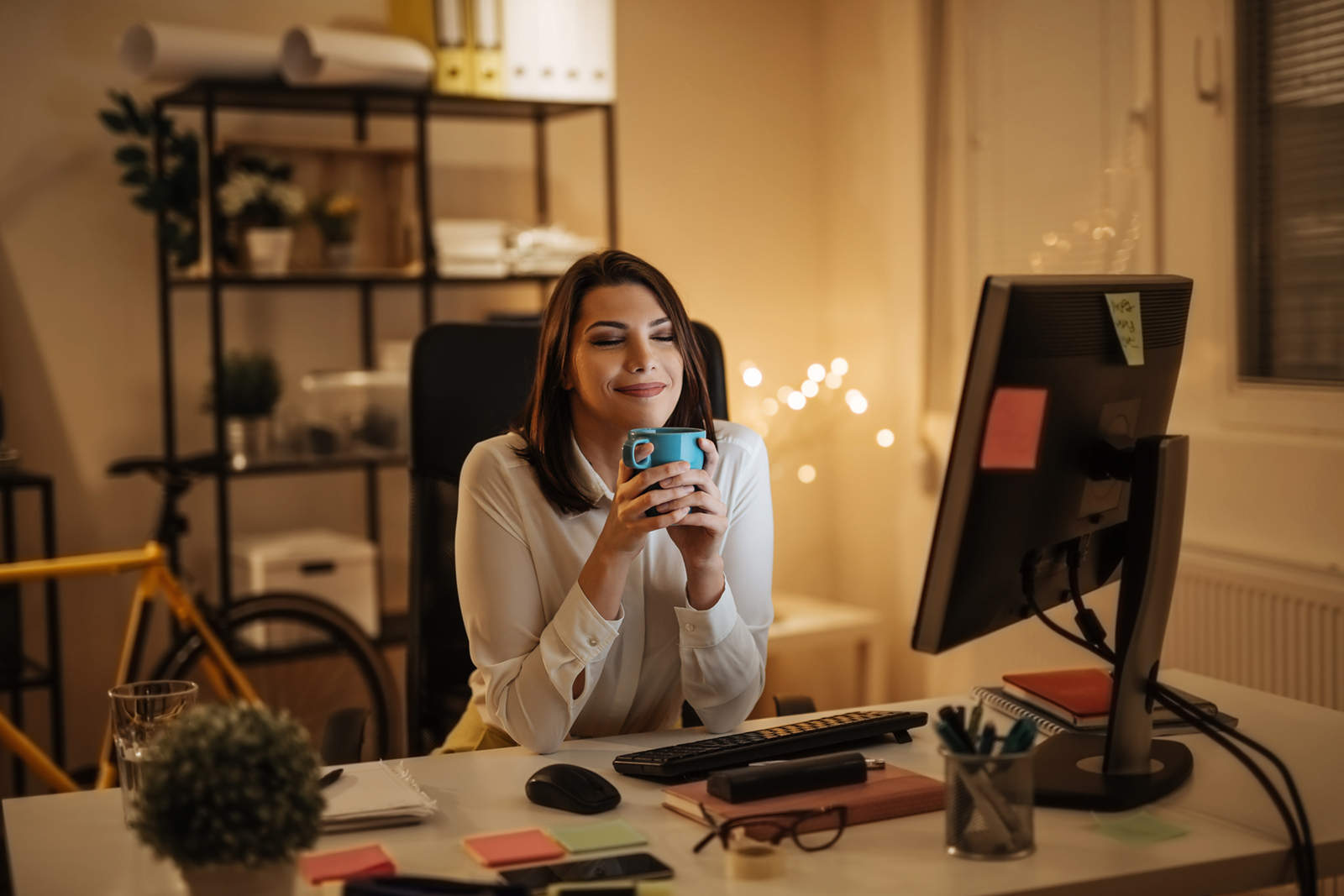 woman in her home office at night