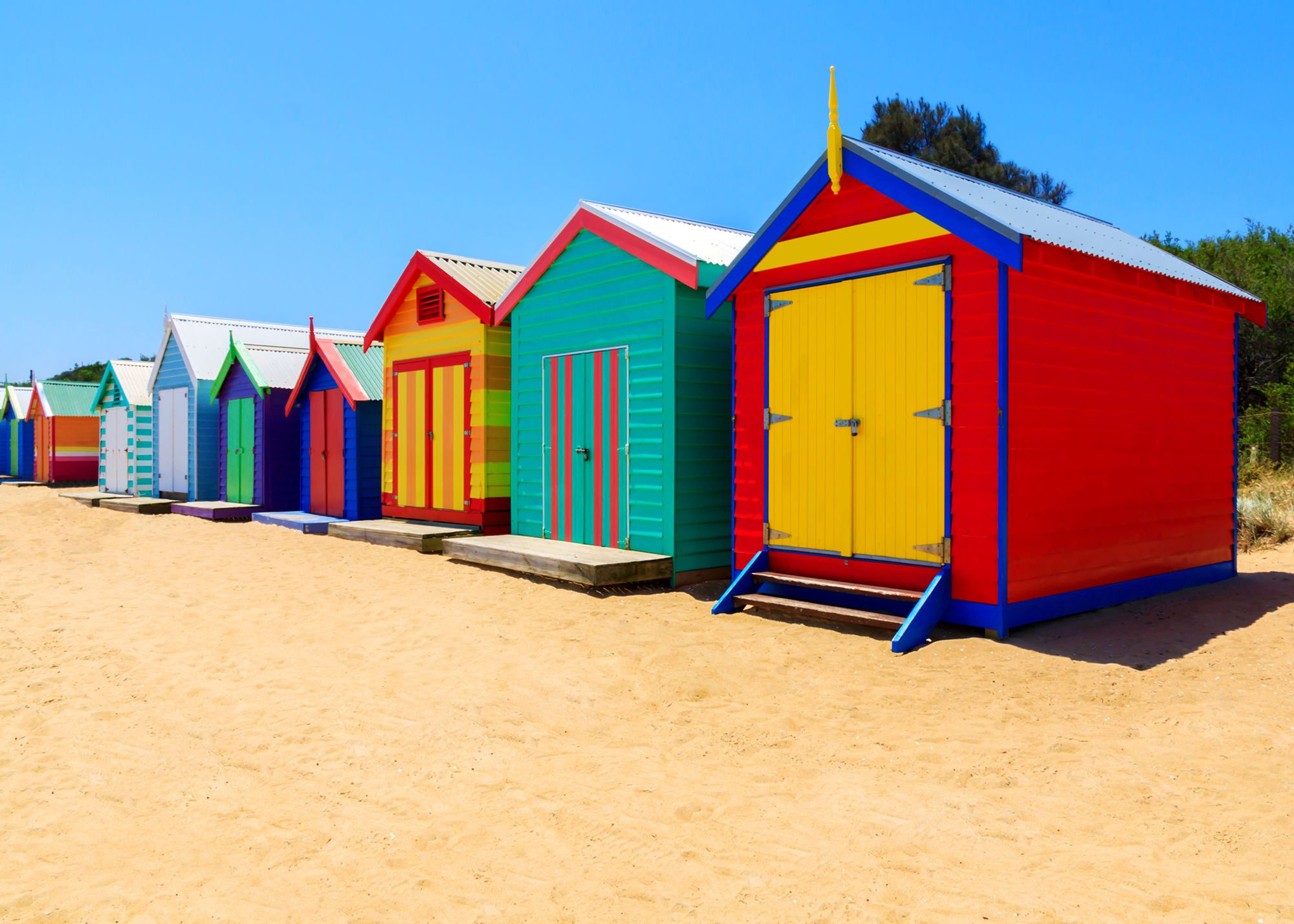 row of beach huts on Brighton beach
